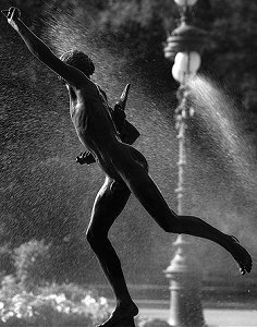 Falguire's Cockfight - weathered copy in a park, backlit against fountain, by Pierre Beteille on Flickr